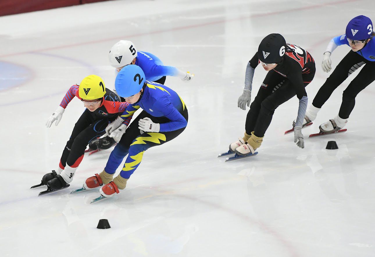 Pack of skaters racing at a meet